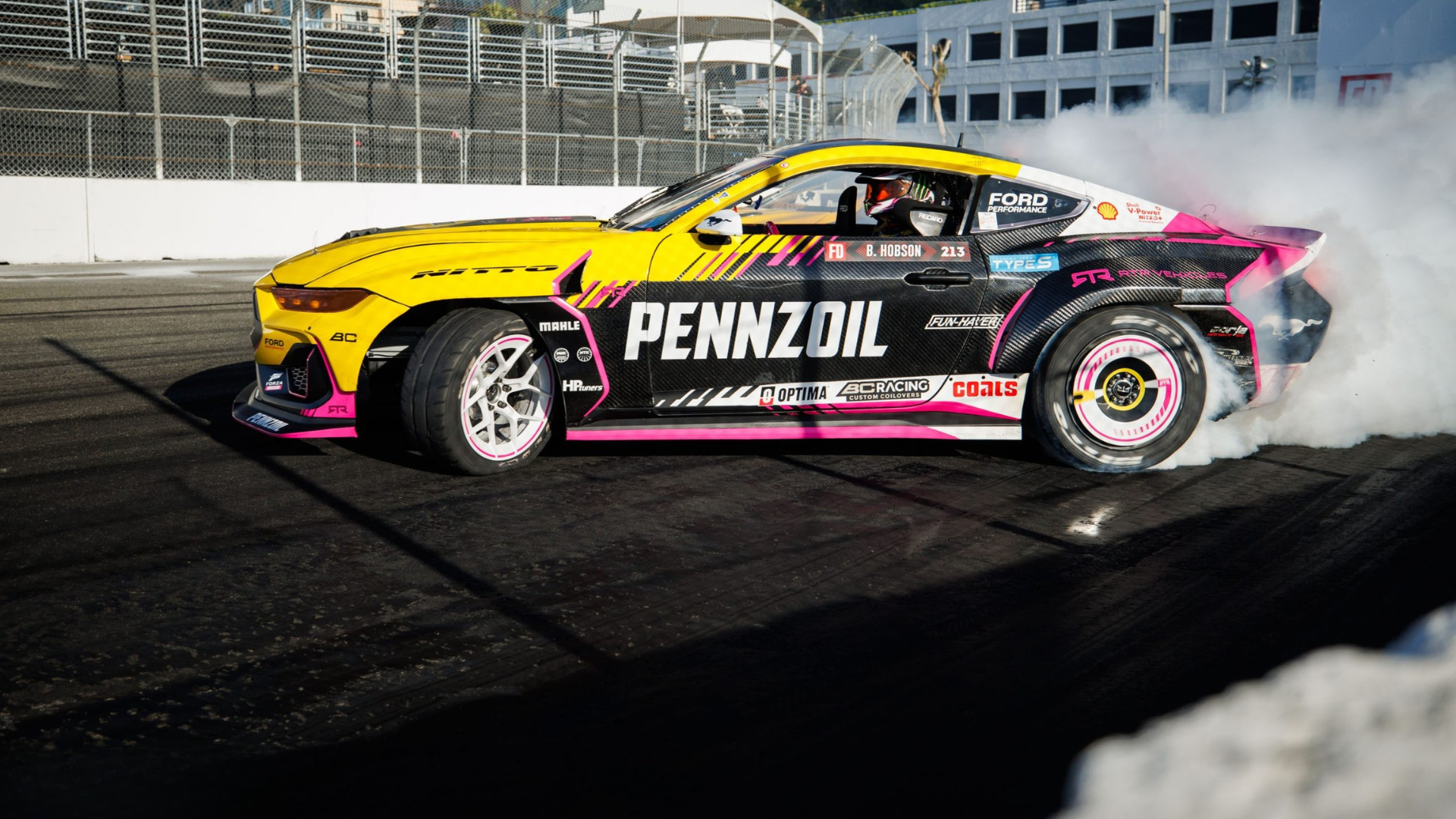 Drift car with multiple visible logos across the body