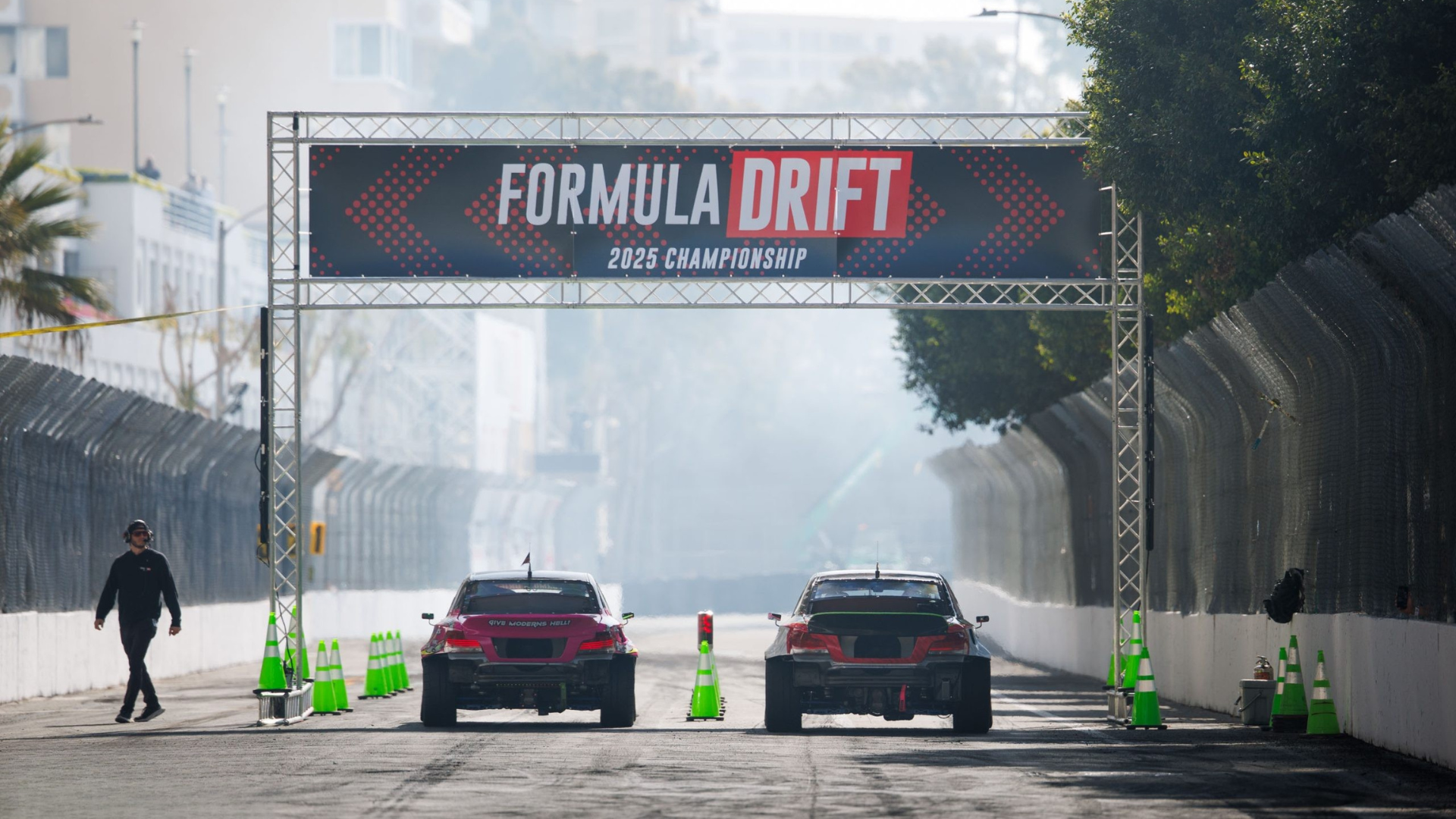 Official championship start arch with two cars lined up on track