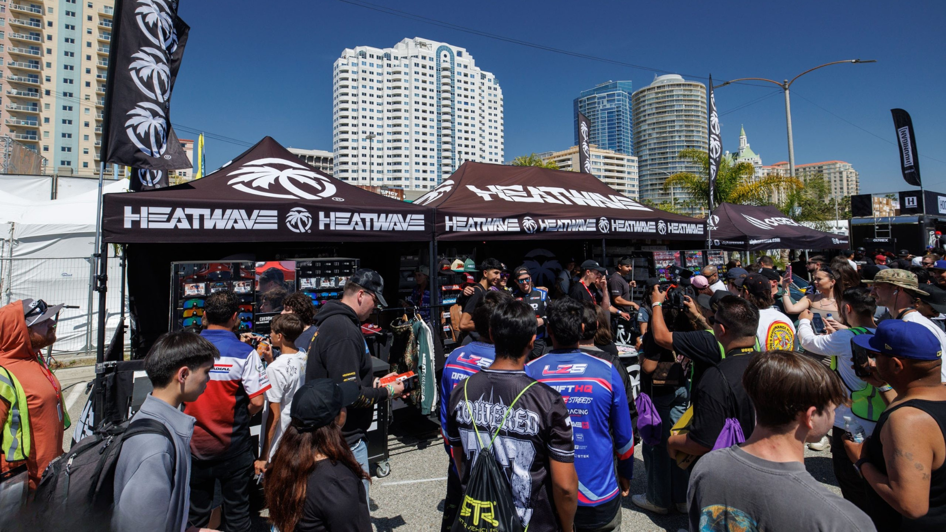 Brand booth with people interacting and content being filmed